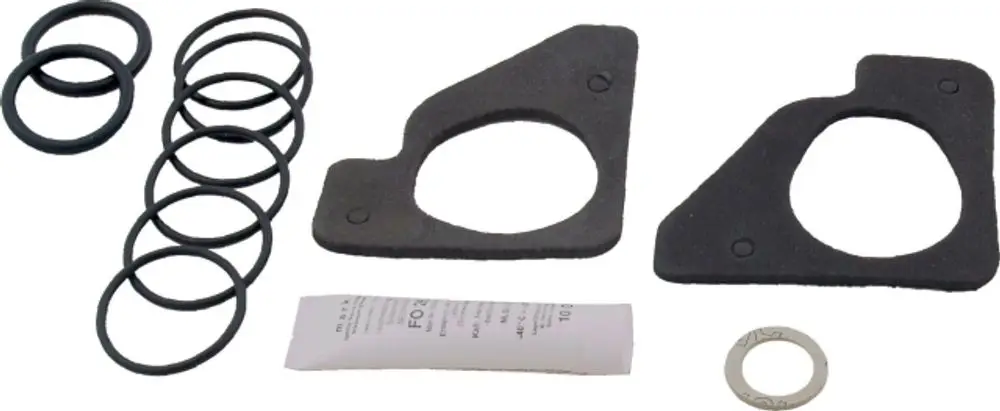 Dichtungsset mit mehreren O-Ringen und Dichtungen, geeignet für Anwendungen von Wolf. Teile in schwarzer und grauer Farbe, unter anderem mit Papieranleitung.